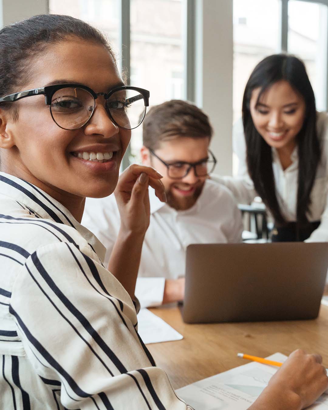 Multiple ethnicities working in an office together